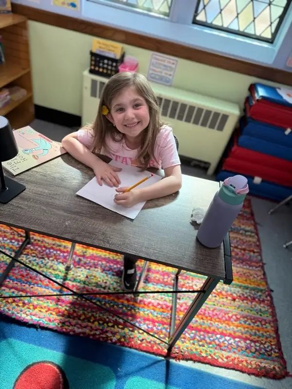 School age student working at a desk